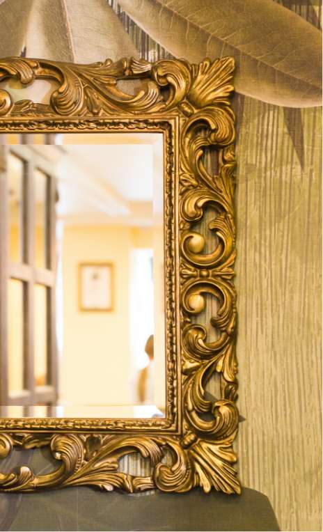 mirror with ornate gold frame