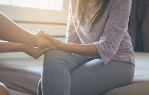 Man,Holding,Hands,For,Counsel,And,Support,To,Depressed,Woman,psychiatrist